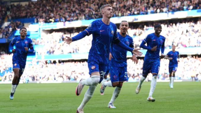 Chelsea's Cole Palmer, centre, celebrates after scoring his second of four first-half goals in a 4-2 win over Brighton on Saturday at Stamford Bridge in London.