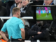 Referee Samuel Barrott consults the VAR monitor at Newcastle United