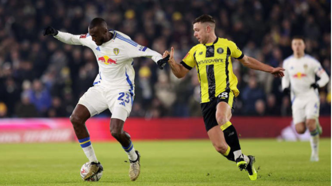 Leeds United player Josuha Guilavogui, pictured left, was lucky not to give away a penalty against Harrogate Town