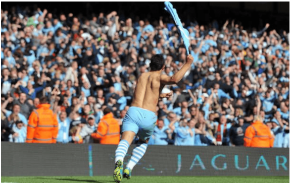 Sergio Agüero latched onto a pass from Mario Balotelli and fired past Paddy Kenny, securing a historic 3-2 victory.